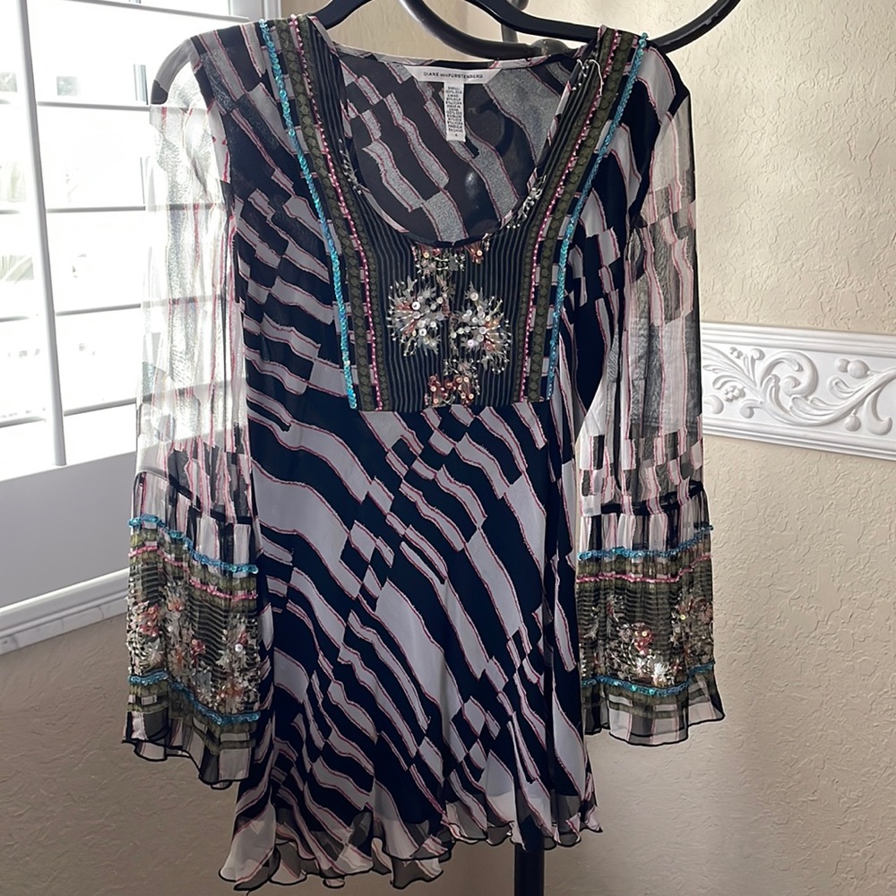 Diane vonFurstenberg silk blouse with beaded detail.
